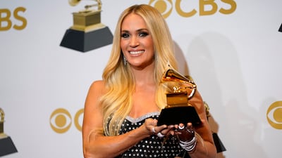 Carrie Underwood, winner of the award for best roots gospel album for 'My Savior,' poses in the press room. AP