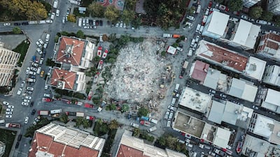 An aerial view in Izmir shows Rescue workers searching for survivors in a collapsed building after a powerful earthquake struck Turkey's western coast and parts of Greece. AFP
