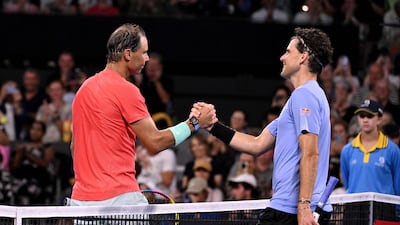 Rafael Nadal shakes hands with Austria's Dominic Thiem after their match. AFP