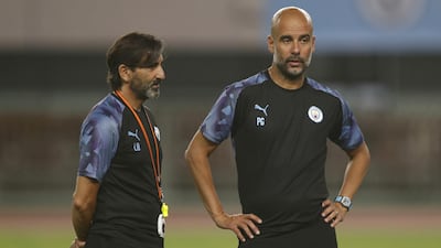 Pep Guardiola, manager of Manchester City, and coach Lorenzo Buenaventura.
