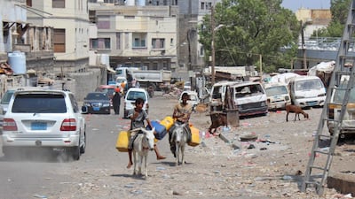 Yemeni youths ride donkeys along a street in the southern port city of Aden. AFP