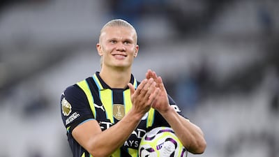 Erling Haaland with the match ball after scoring a hat-trick in Manchester City's 3-1 Premier League win over West Ham United at the London Stadium on August 31, 2024.