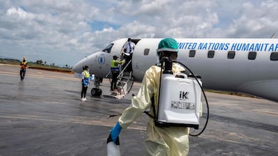A health worker prepares to decontaminate a plane and passengers at Bunia Airport in the Democratic Republic of Congo. AFP