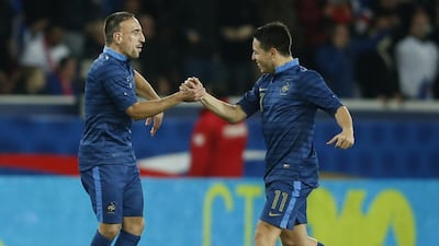 France's Franck Ribery with teammate Samir Nasri in 2013. Reuters