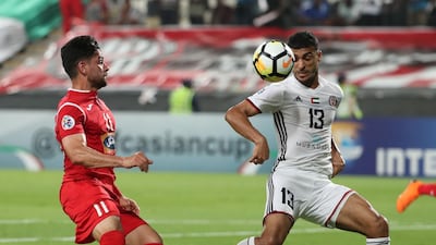 Al Jazira's Mohammad Al Musalami, right, and Kamal Kamyabinia of Persepolis vie for the ball during their Asian Champions League game at Mohammed bin Zayaed Stadium in Abu Dhabi. Karim Sahib / AFP