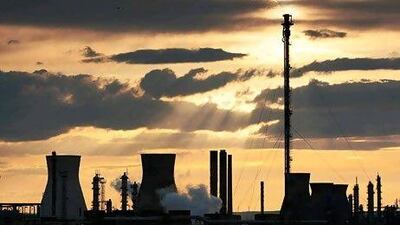 There are economic opportunities from cutting greenhouse emissions in fossil fuel facilities such as coal power plants. Ed Jones / AFP