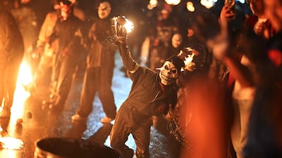 Masked revellers attend the traditional Fireball Festival in Nejapa, El Salvador, an event that first took place in 1922. AFP