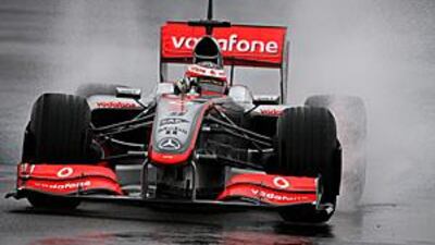 Heikki Kovalainen drives through the rain in Jerez during Formula One's testing window prior to the start of the new season in Melbourne.