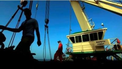 Engineers pictured earlier this year working on the salvation of the sunken White Whale ship in Umm Al Quwain.