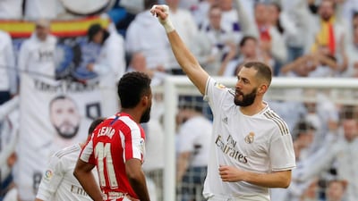 Real Madrid's Karim Benzema celebrates scoring his team's first goal against Atletico Madrid at the Santiago Bernabeu. Reuters