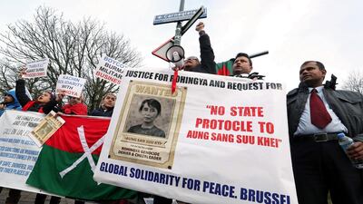 People demonstrate against Myanmar's leader Aung San Suu Kyi on the second day of hearings in a case filed by Gambia against Myanmar alleging genocide against the minority Muslim Rohingya population, outside the International Court of Justice (ICJ) in The Hague, Netherlands December 11, 2019. REUTERS/Yves Herman
