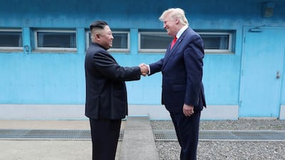 US President Donald Trump with North Korean leader Kim Jong-un in the DMZ separating the two Koreas, Panmunjom. KCNA via Reuters