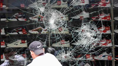 A broken shop window of a shoe store in Stuttgart,Germany on June 21, 2020. AFP
