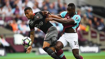 Ryan Bertrand of Southampton and Michail Antonio of West Ham United battle for the ball. Shaun Botterill / Getty Images