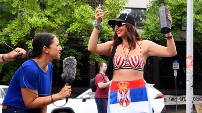 Media and members of the local Serbian community wait outside a hotel where Serbia's tennis champion Novak Djokovic is being held after Australia said it had cancelled his entry visa, opening the way to his detention and deportation in a dramatic reversal for the tennis world No 1. AFP