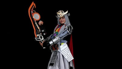 Ange, a young Indonesian Muslim cosplayer, is seen here dressed as the Kamen rider Gaim, taking part in the hijab cosplay event in Subang Jaya, outside of Kuala Lumpur, on April 29, 2017. Manan Vatsyayana / AFP