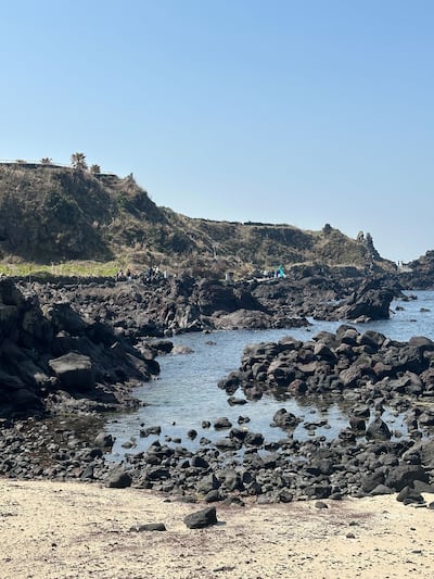 Black basalt rocks along the coast show Jeju Island's volcanic origins. Fatima Al Mahmoud / The National