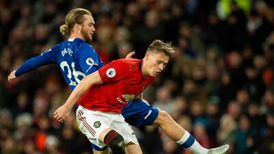 Everton's Tom Davies (L) in action with Manchester United's Scott McTominay. EPA
