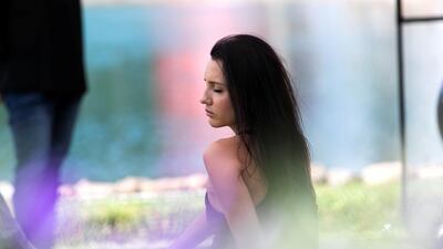 A woman meditates at YOGAFEST.