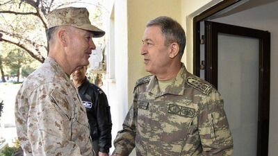 The chairman of the US joint chiefs of staff Gen Joseph Dunford, left, meets the Turkish military chief Gen Hulusi Akar at Incirlik air base in Adana, Turkey on February 17, 2017. According to reports, the two military leaders discussed operations against ISIL in Syria. Turkish Armed Forces General Staff Press Office / EPA