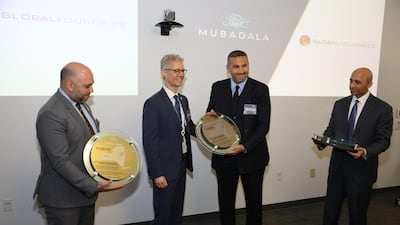 Khaldoon Al Mubarak, chief executive of Mubadala, (2nd from right) and UAE Ambassador to the US, Yousef Al Otaiba, receiving an award at GlobalFoundries in New York, USA. Courtesy GlobalFoundries