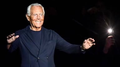 (FILES) Italian fashion designer Giorgio Armani acknowledges applause following the presentation of his men's fall/winter 2020/21 fashion collection in Milan on January 13, 2020. Italian fashion great Giorgio Armani has died at the age of 91 "surrounded by his loved ones", his company said on September 4, 2025. (Photo by Miguel MEDINA / AFP)