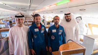 The astronauts pose for a photo