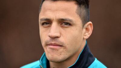 Arsenal's Chilean striker Alexis Sanchez is pictured as he takes part in a training session ahead of the UEFA Champions League round of 16 1st leg football match against Barcelona at Arsenal's London Colney training ground on February 22, 2016. Arsenal will play against Barcelona at the Emirates Stadium in London on Tuesday February 23, 2016. / AFP / GLYN KIRK