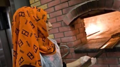 Emirati Laila Ali, 26, of Dubai, enjoys her job as a baker in the Al Mizhar area store in Dubai. Amy Leang / The National