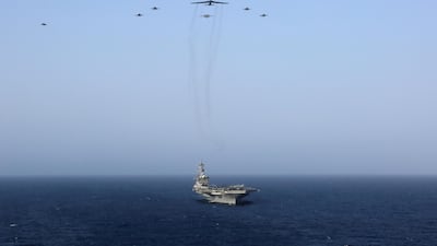 United States aircraft carrier Abraham Lincoln (CVN 72) and a U.S. Air Force B-52H Stratofortress, deployed to the region. US Navy via Reuters