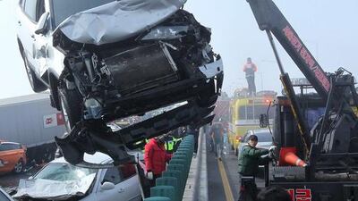 “I heard a series of bangs in front of me. Then I was rear-ended by a following car. I felt my car turning around and hitting a protection rail. I then lost consciousness,” cab driver Yoo Sang-Young told Yonhap news agency. James Park / EPA