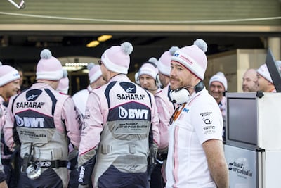 Sahara Force India's pit crew, pictured in their distinctive pink race suits and bobble hats, at the Yas Marina Circuit. Christopher Pike / The National