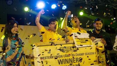 Deepak Sharma, 25, centre left, and Tayyab Tahir, 25, centre right, celebrate winning Camp Ka Champ contest at Jiwin Staff Accommodation in Dubai. Christopher Pike / The National
