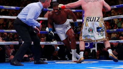 Anthony Joshua heads to the canvas after a punch from Andy Ruiz Jr. Reuters