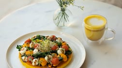 Chickpea omelette with crispy kale, tomato confit, mayo, carrot cream, balsamic glaze and roasted pumpkin seeds. Photo: Planet Terra