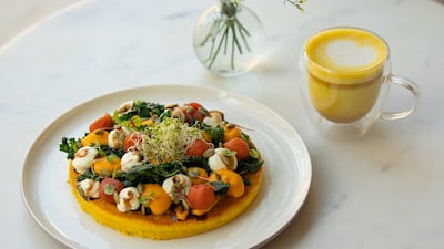 Chickpea omelette with crispy kale, tomato confit, mayo, carrot cream, balsamic glaze and roasted pumpkin seeds. Photo: Planet Terra