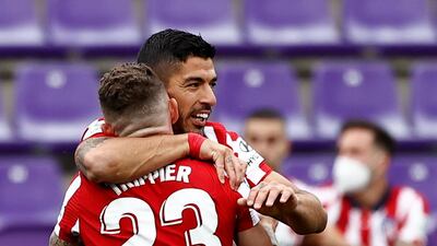 Luis Suarez celebrates after scoring Atletico Madrid's second goal against Valladolid. Reuters