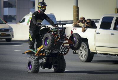 The Dubai Police and Dubai Motorbike Festival break the Guinness World Record for the world’s longest wheelie on an ATV. Courtesy: Dubai Police.