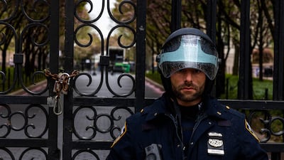 A police officer stands by the entrance to Columbia University in New York City, where protests are being staged. Getty Images