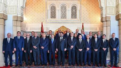 Morocco's King Mohammed VI, centre, Prime Minister Saad Dine El Otmani, to his right, and members of the new Moroccan cabinet appointed on October 9, 2019. Moroccan Royal Palace via AP