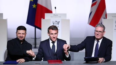 Mr Starmer and French President Emmanuel Macron, centre, sign a Declaration of Intent with Ukrainian President Volodymyr Zelenskyy to send forces to Ukraine in the event of a peace deal, during the Coalition Of The Willing meeting in Paris in January. Getty Images