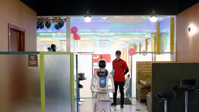 Timea brings food to a table at the Times Fast Food restaurant in Kabul, Afghanistan. Reuters