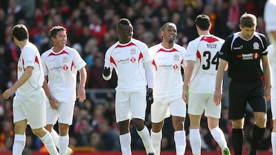 Didier Drogba celebrates with Mario Balotelli after scoring the second goal. Alex Morton / Reuters