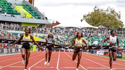 Elaine Thompson-Herah, left, wins the race. AP