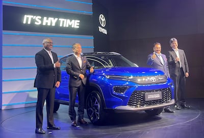 Toyota Kirloskar Motor's vice president PB Venugopal, managing director Masakazu Yoshimura, vice chairman Vikram Kirloskar and executive vice president sales and customer service Tadashi Asazuma pose at the unveiling of Toyota's new hybrid SUV Urban Cruiser Hyryder in New Delhi, India. Reuters