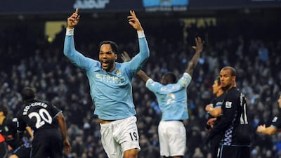Joleon Lescott celebrates scoring against Aston Villa on December 28, 2010, then in his second season with Manchester City. He wound up appearing in 107 Premier League matches over five seasons with the club. Nigel Roddis / Reuters