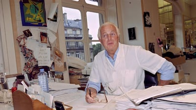 In this file photo taken on July 03, 1995 French fashion designer Hubert de Givenchy poses at the office of his fashion house in Paris. AFP