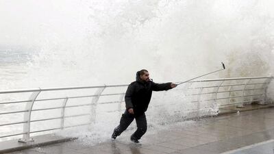 A man takes a selfie by a crashing wave on Beirut's Corniche as high winds sweep through Lebanon during a storm. Mohamed Azakir/ Reuters