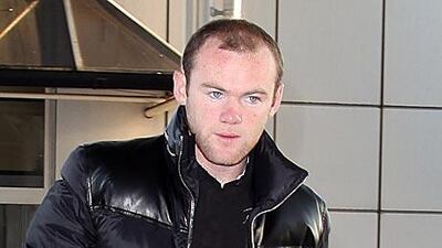 Wayne Rooney heads for his flight to the US.