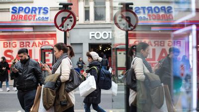 The U.K. economy expanded less than previously estimated in the fourth quarter as consumers and businesses absorbed faster price increases. Jack Taylor / Getty Images)